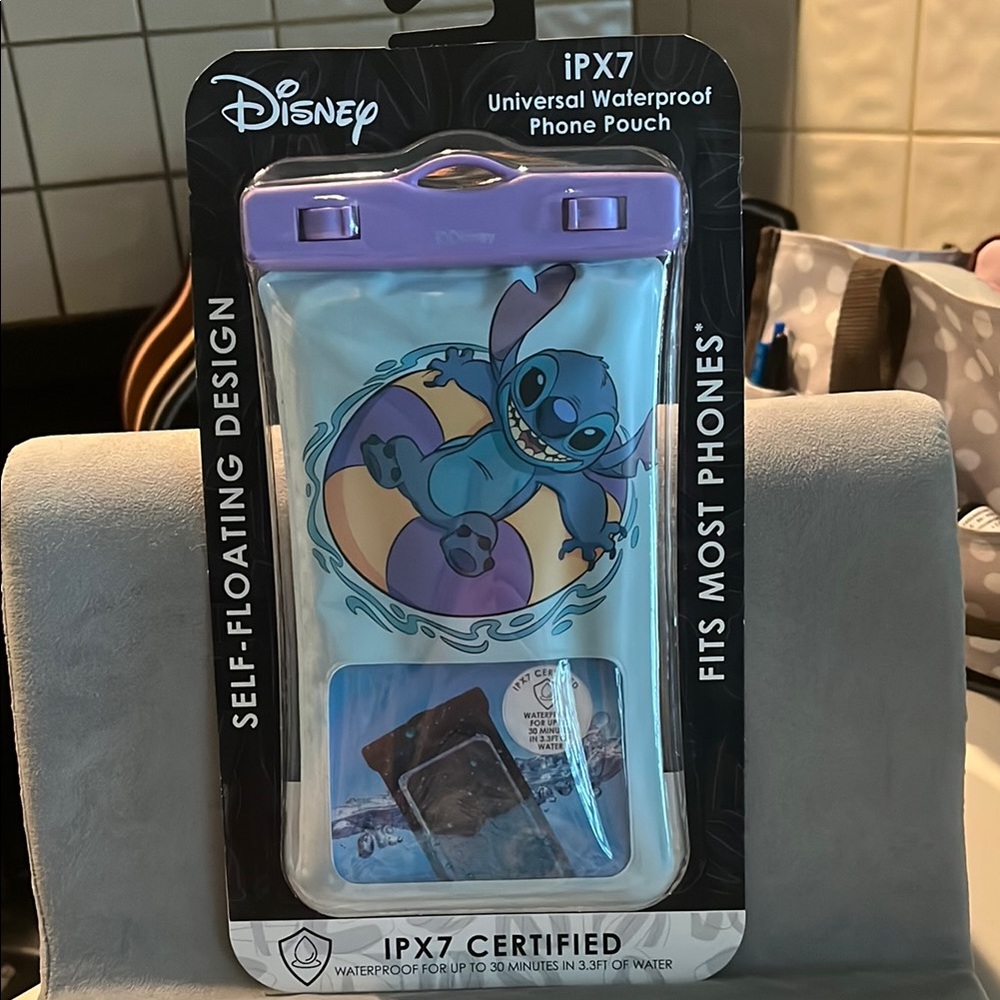 Disney Universal Waterproof Phone Pouch - Purple. Stitch with lanyard